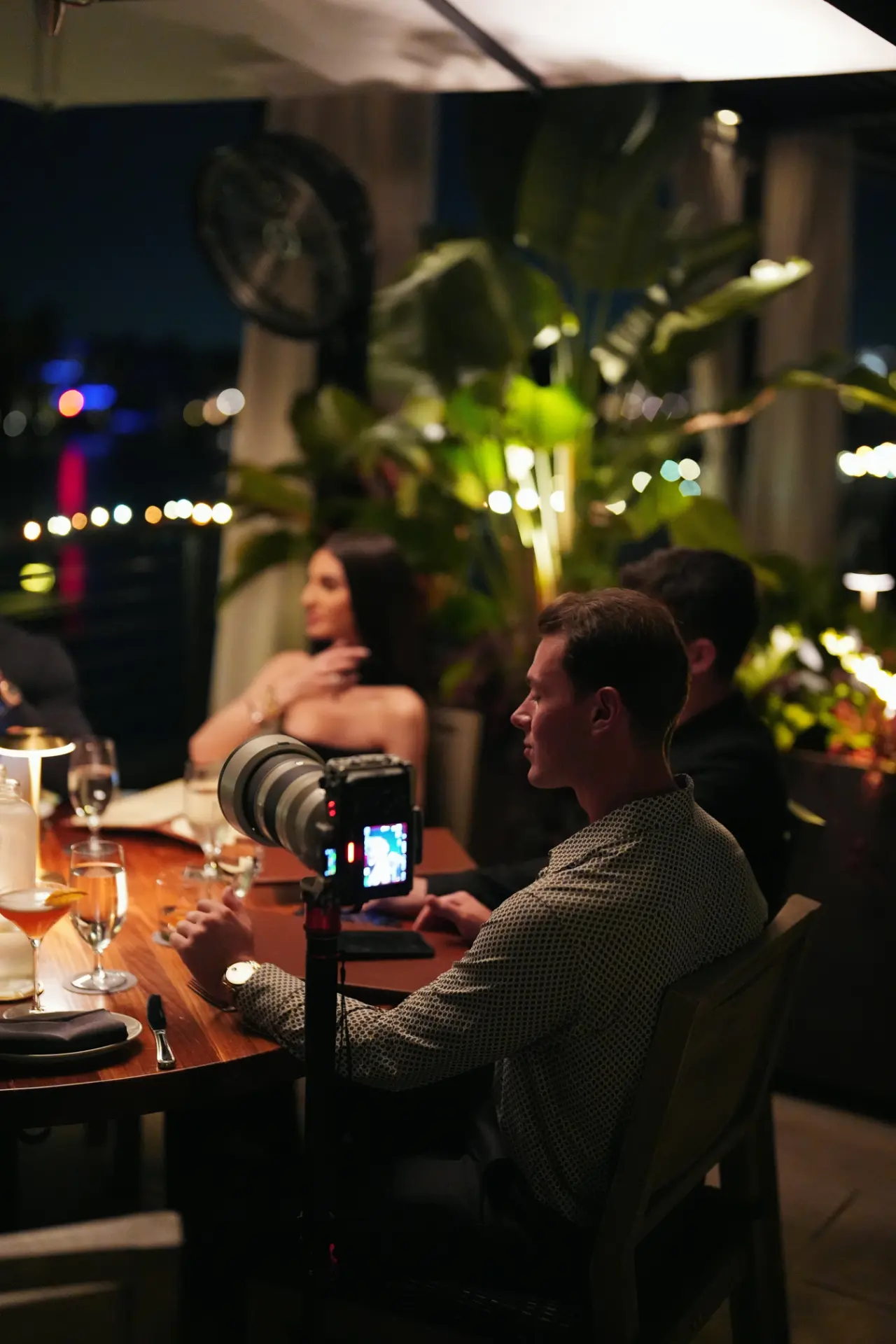 Evening dinner with a camera set up on the table at a restaurant